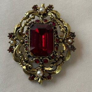Elegant Gold and Red Brooch